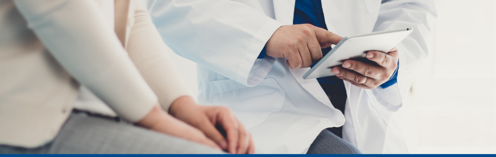 Doctor discussing something with a patient