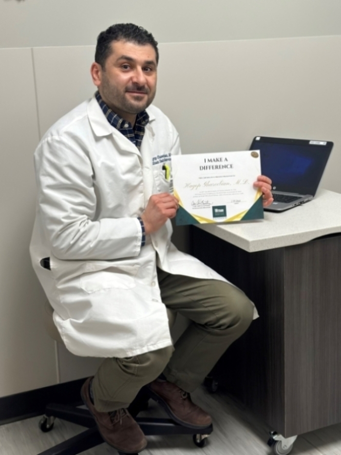 Dr. Ghareebian accepting Award