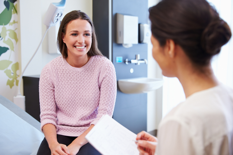 A woman speaking with her doctor