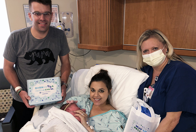 Witham Health Services Partners with Fifth Third Bank to surprise the Doyle family on May 3 with $1,053 and gifts for their newborn