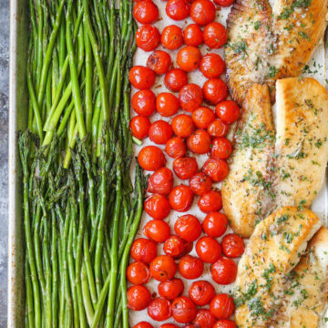 Asparagus, Tomatoes and Tilapia on a baking sheet