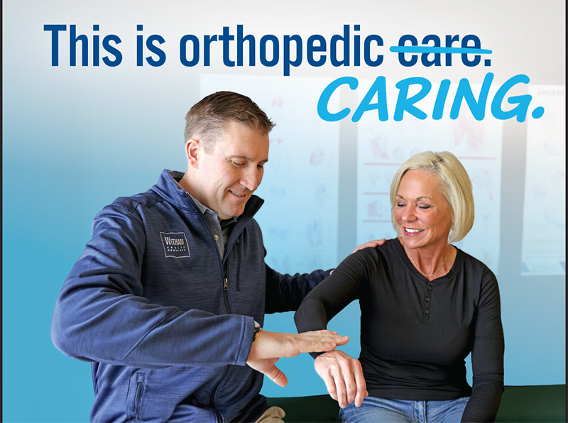 Dr. Horn examines a patient's shoulder. 