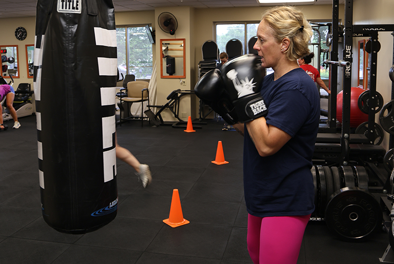 A lady with boxing gloves on