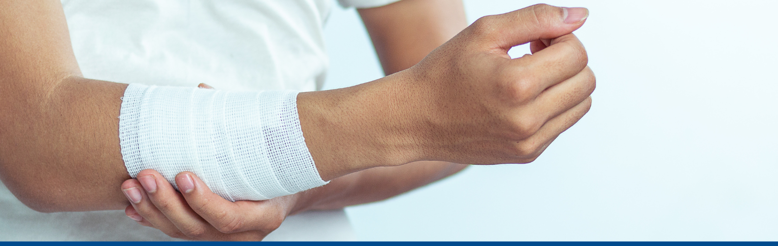 A man with a bandaged arm
