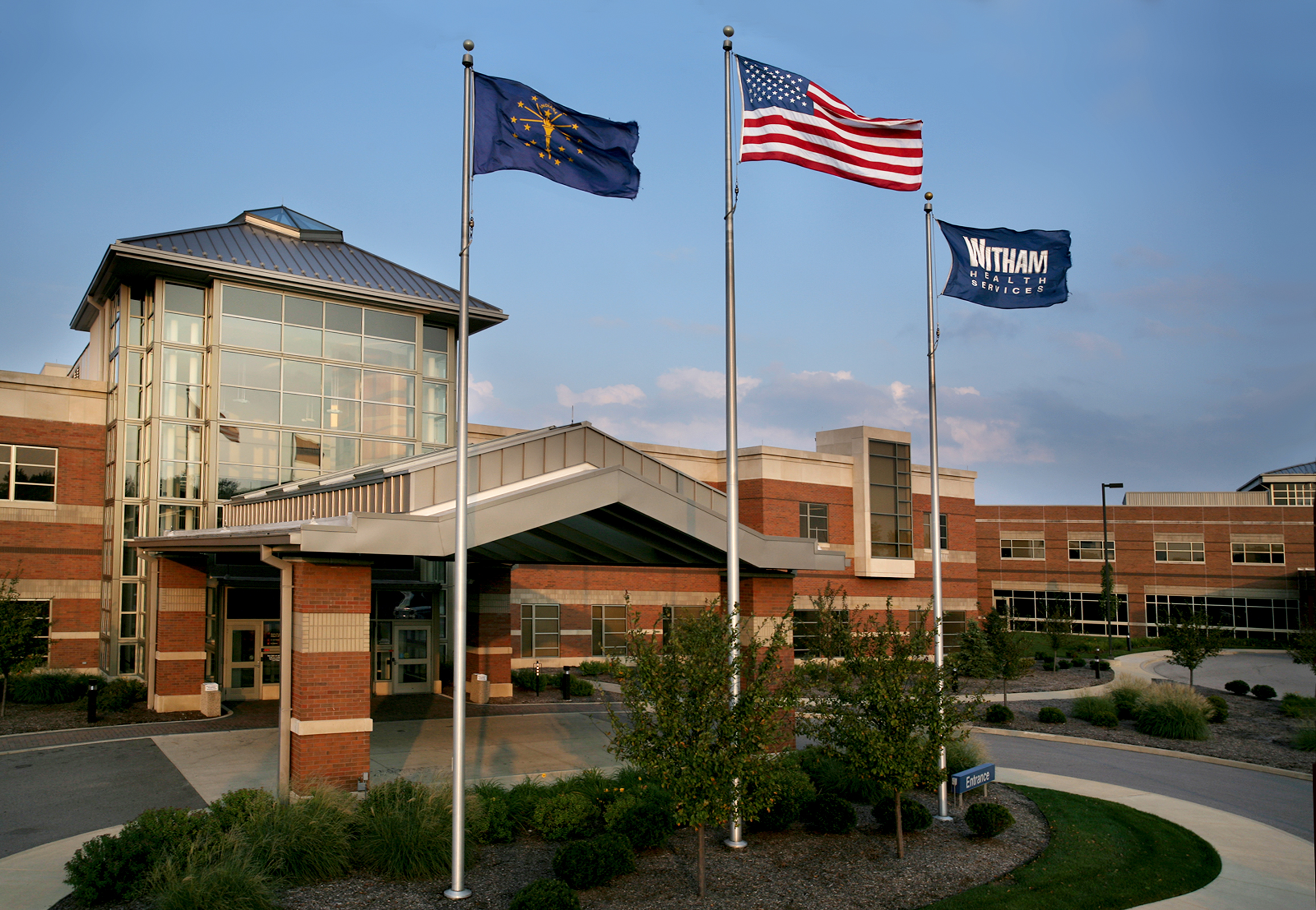 Hospital front with flags