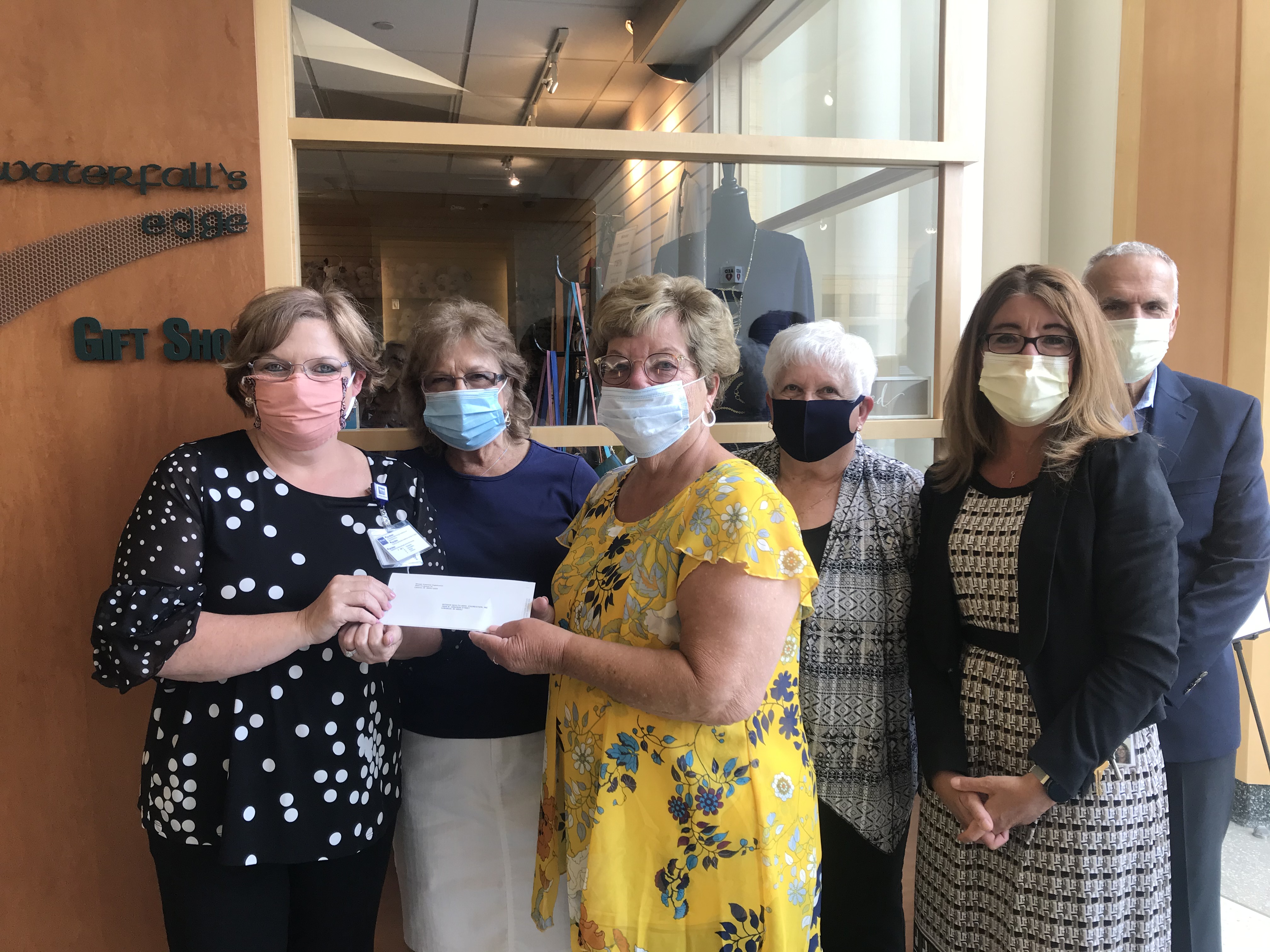 Volunteer Organization Donates Money to Foundation