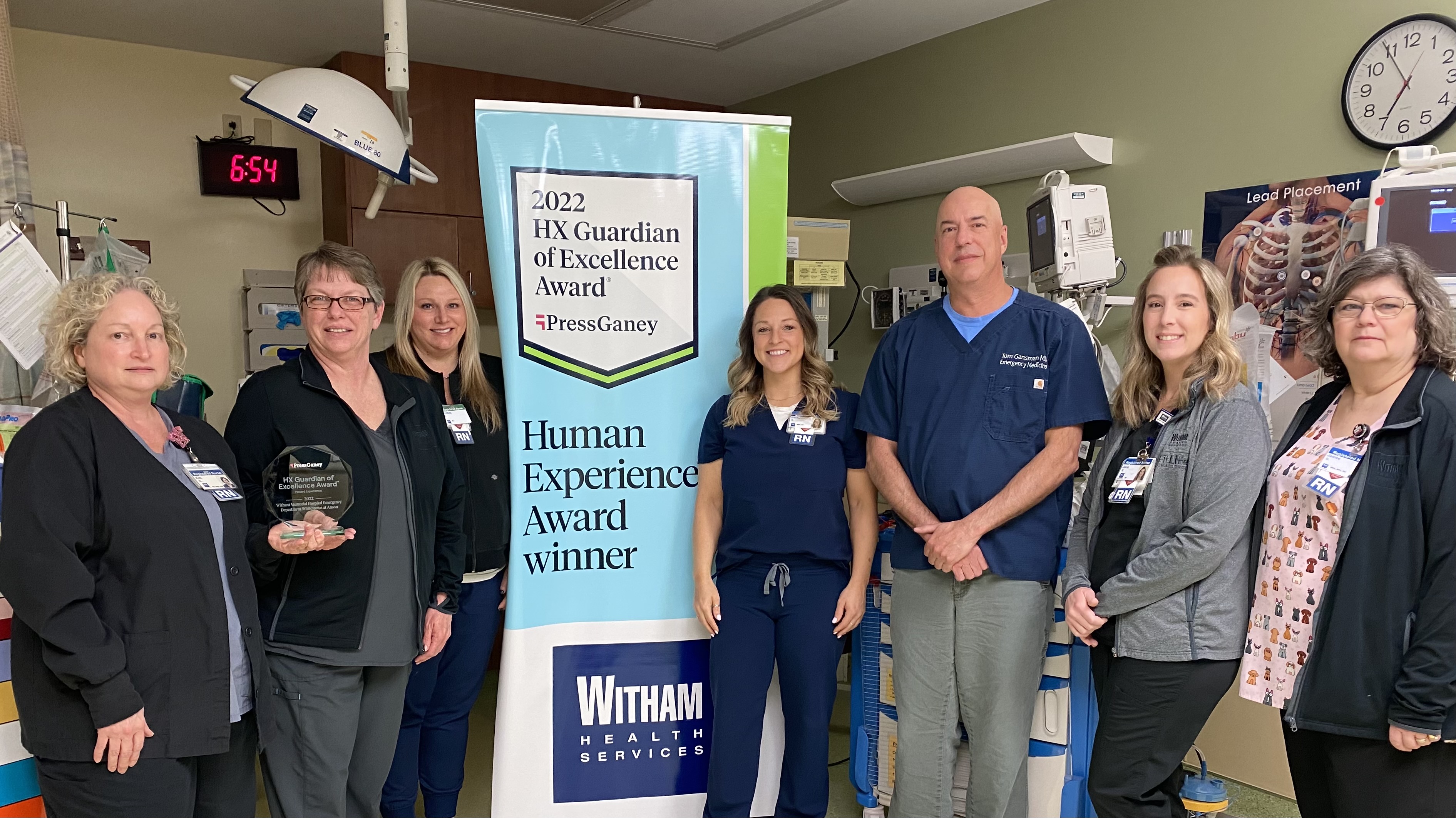 Witham ER Staff with Press Ganey award and Banner
