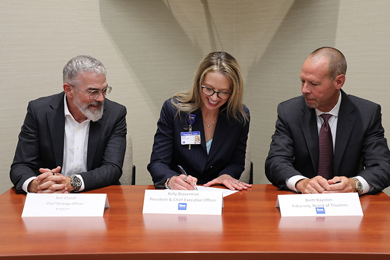 Rich Church, Parkview Health Chief Strategy Officer, Kelly Braverman, Witham President and CEO, and Brett Bayston, Witham Board of Trustees Fiduciary sign the Parkview Witham Affiliation Agreement